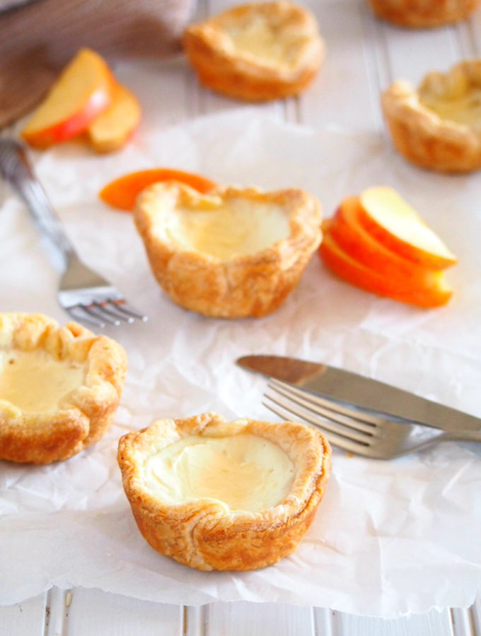 These delightful egg tarts are made of cheesy and creamy egg whites custard and nestled into light, flaky and buttery puff pastry crusts. These little treats are delicate, melt in your mouth bites with a very buttery crisp touch from the puff pastry.