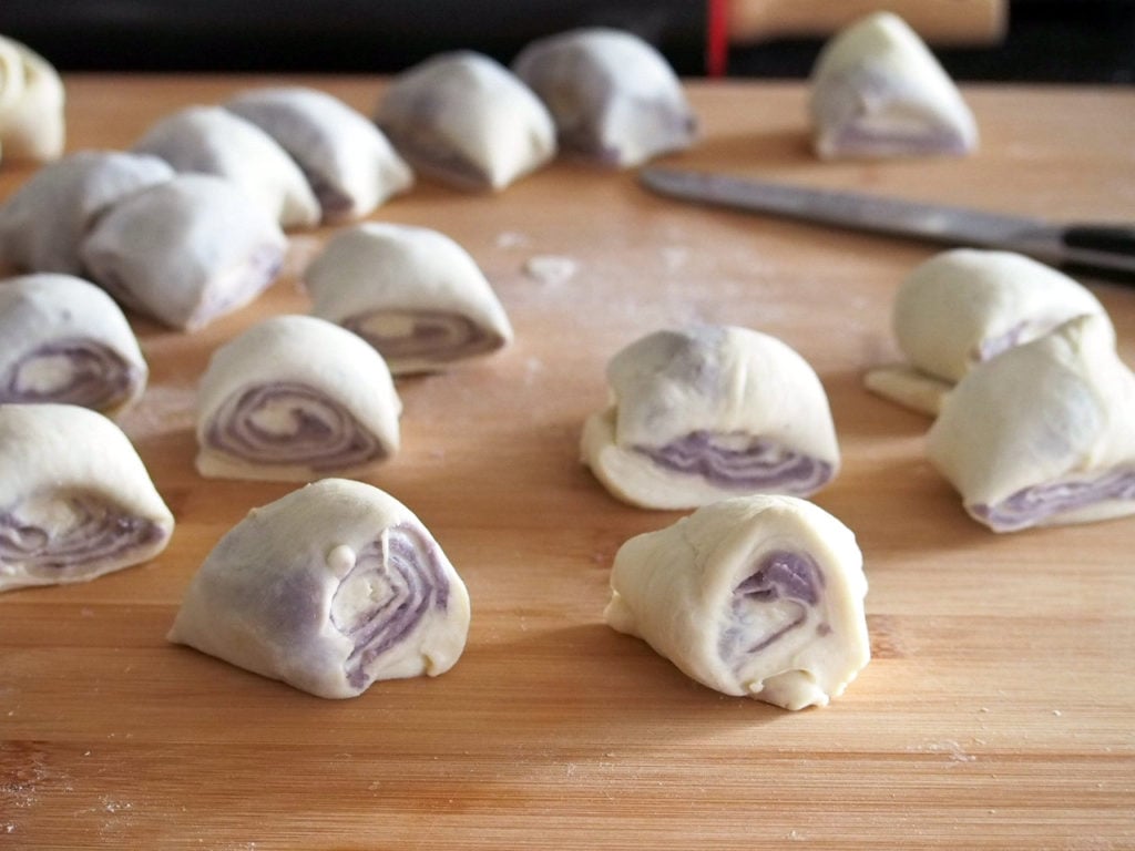 Ube rolls are soft bread rolls with a creamy and heavenly ube (purple yam) filling.