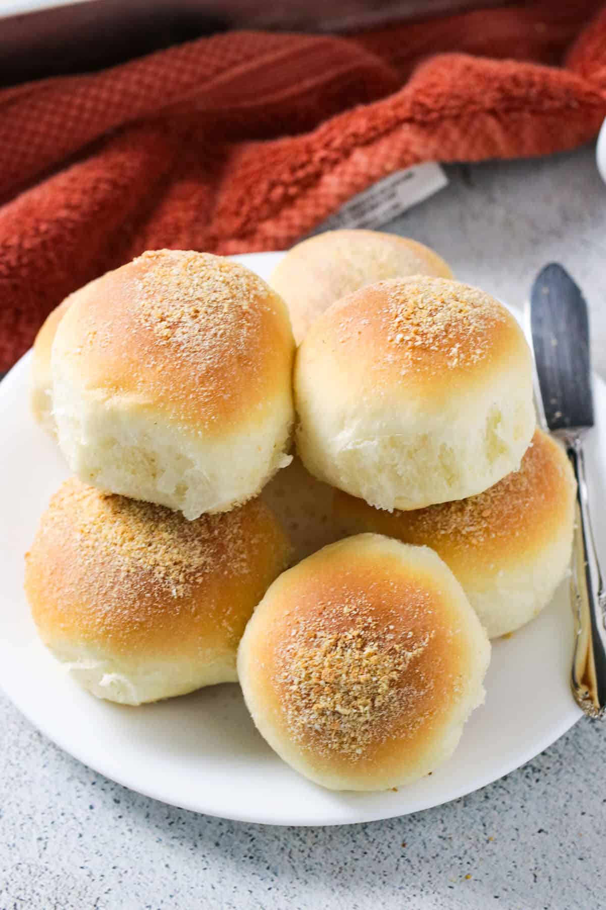 Pandesal on a serving plate.