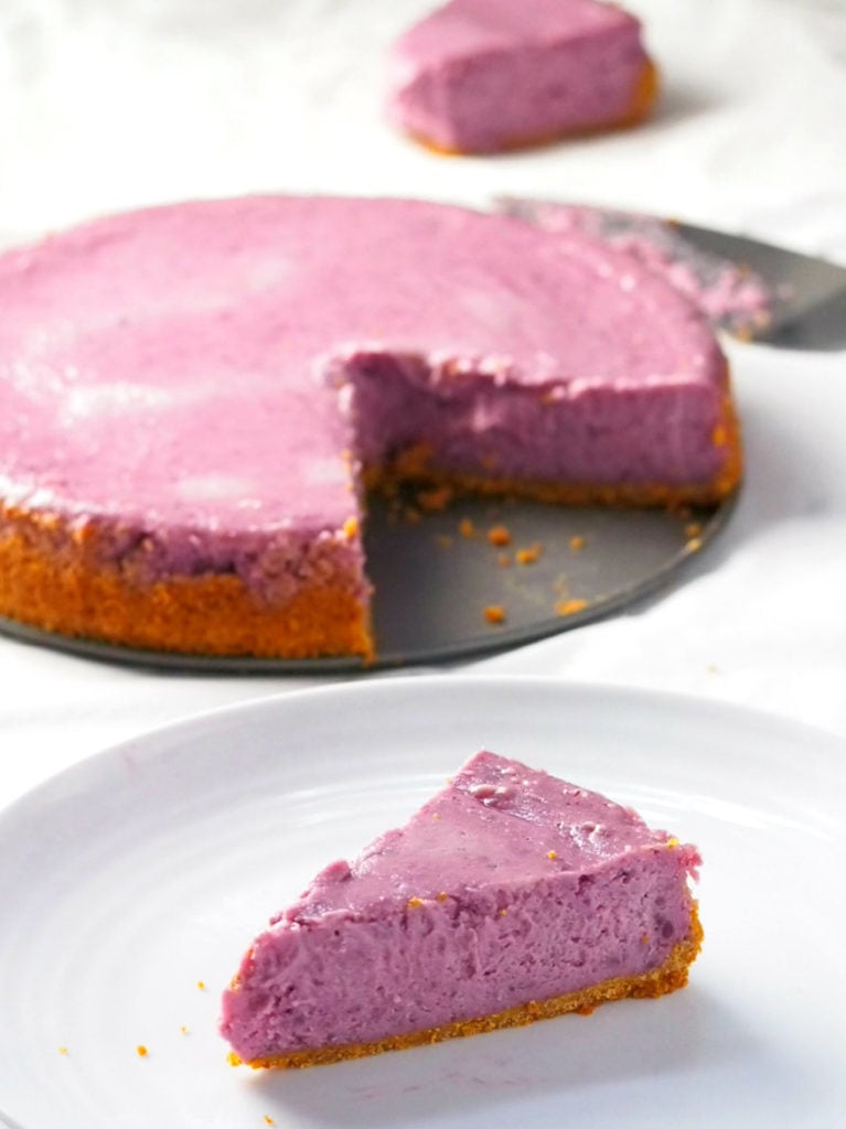 One slice of ube cheesecake on a plate.