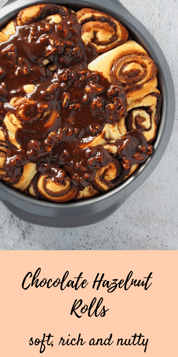 Easy bread dough filled with luscious Nutella spread then topped with more Nutella glaze and nuts. These Nutella Buns is totally delicious! Nutellarolls #Hazelnutrolls #Nutellabuns