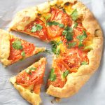 Serve this Cheese Tomato Galette as a snack or as a light meal and delight your guests with the appetizing combination of tomato and cheese enclosed in a crisp and flaky pastry.