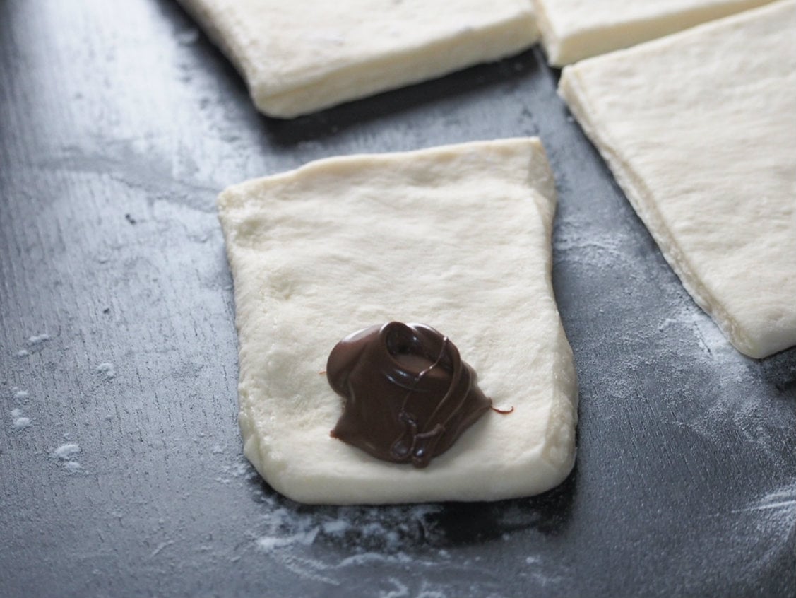 Nutella spread on the mini rectangle dough.