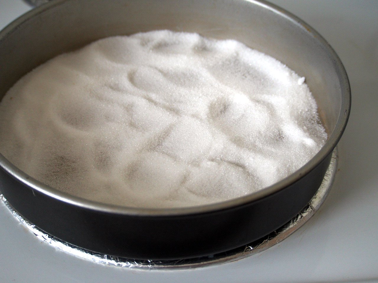 Sugar cooked on a pan until it caramelizes.