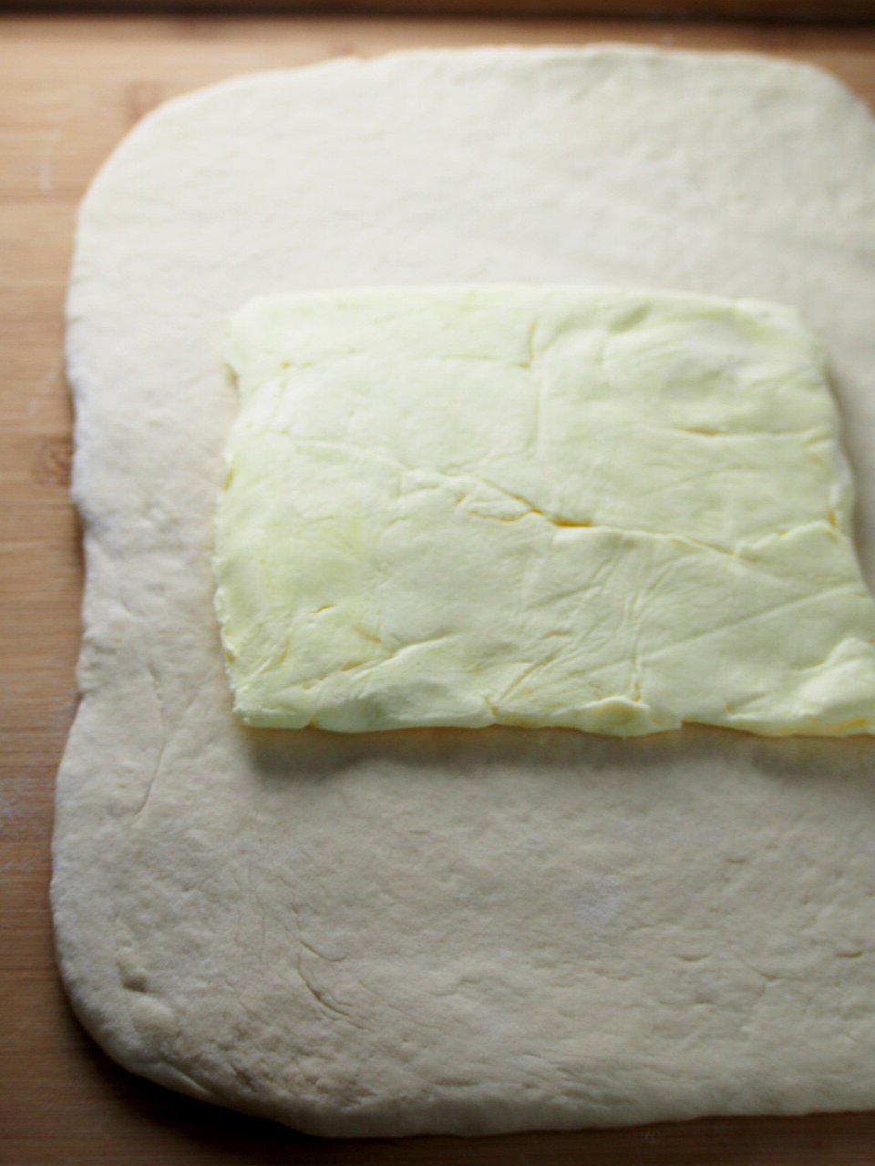 The butter block place in the center of the rectangular dough.