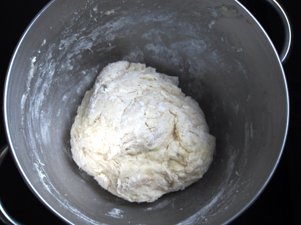 The dough gathers in the center of the bowl.