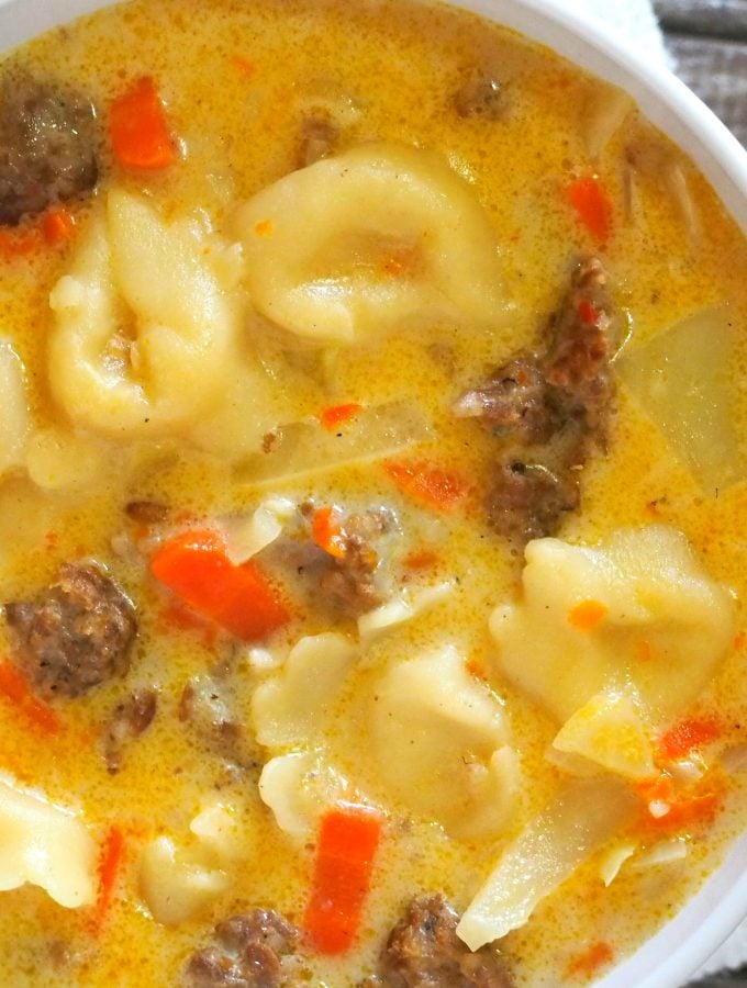 Creamy Sausage Tortellini Soup with creamy and tasty broth, crunchy vegetables and flavorful Italian sausage is a perfect comfort food on a cold day.