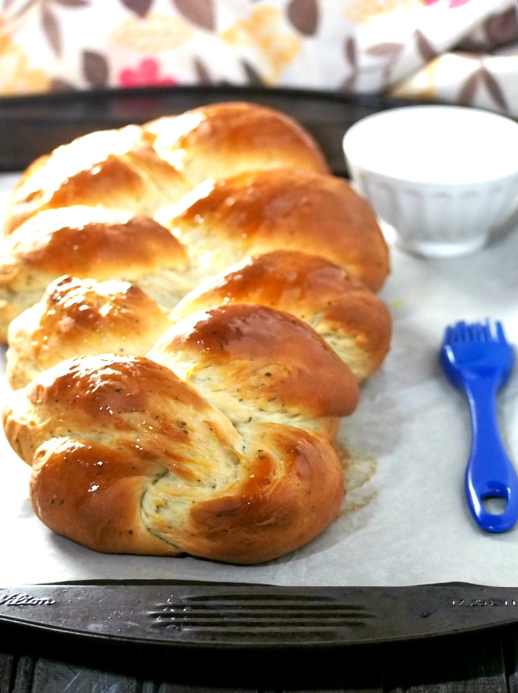 Garlic Herb Bread is a tasty braided loaf that is infused with herbs and full of savory garlic flavor. Serve this as a side along with your meal or alone as a filling snack.
