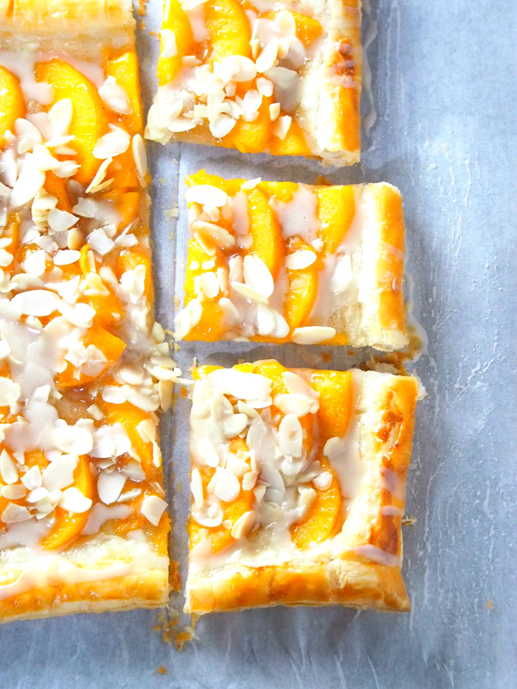 This peach tart is a delicious and easy peach dessert recipe that uses read-made puff pastry and yields a fresh, butteyr and flaky pastry dessert.