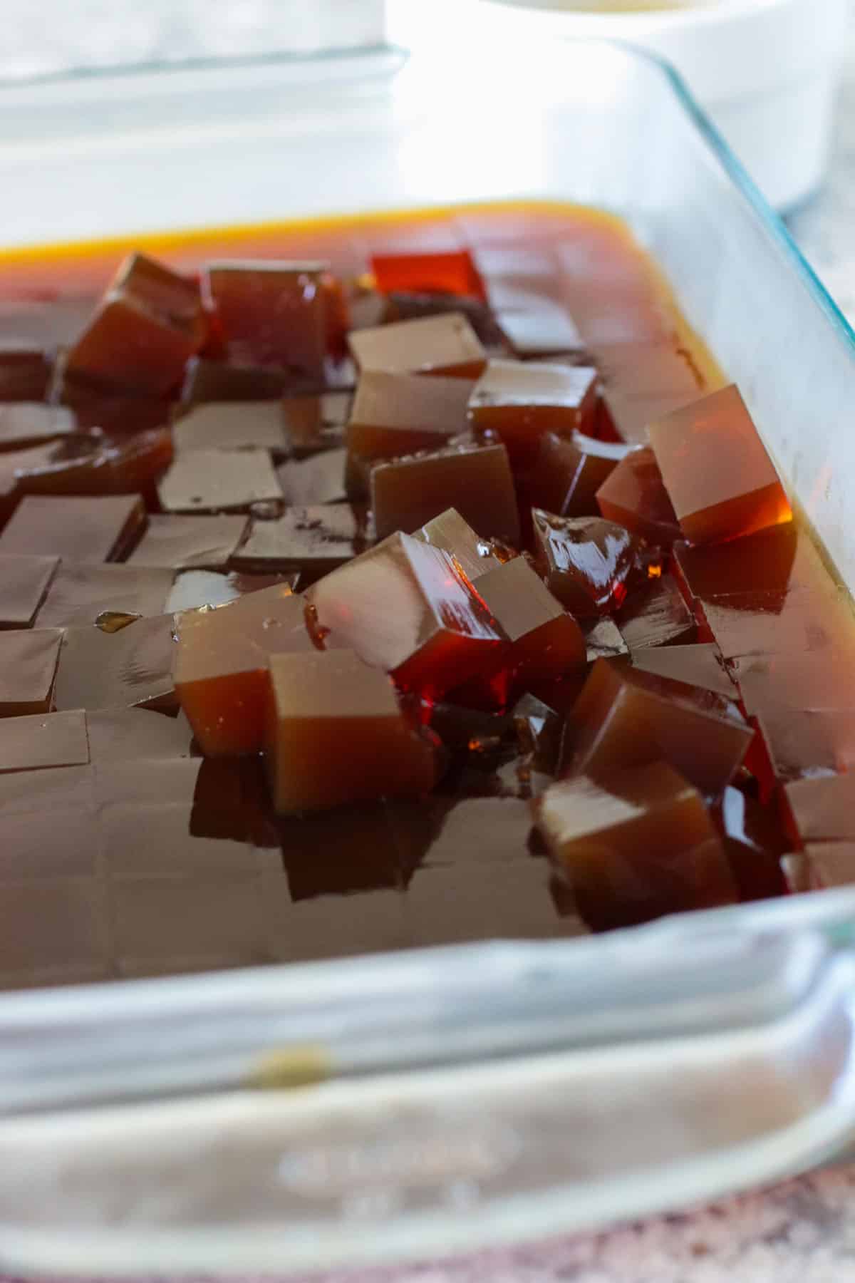 The cubed coffee jelly on a baking dish.