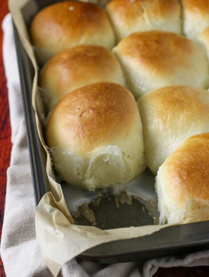 Pani Popo or Coconut bread on a baking pan.
