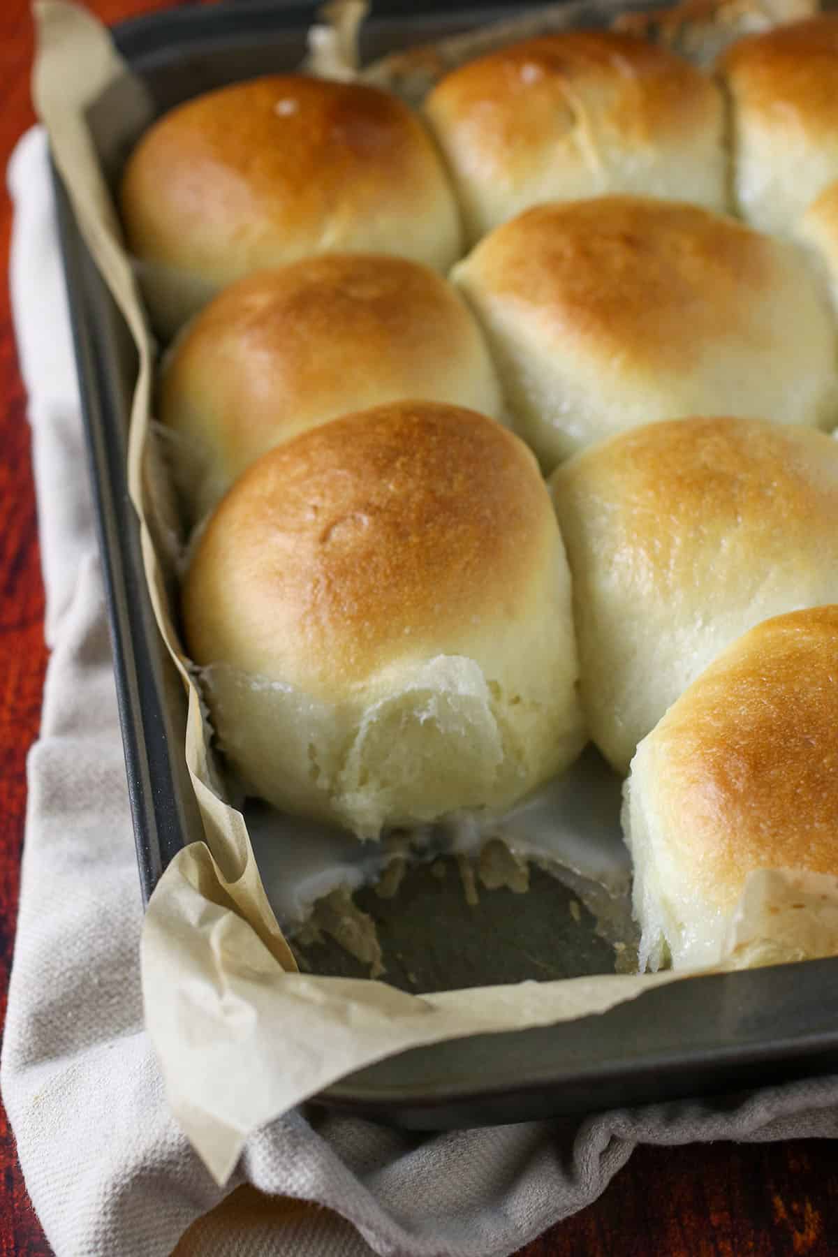 Pani Popo or Coconut bread on a baking pan.