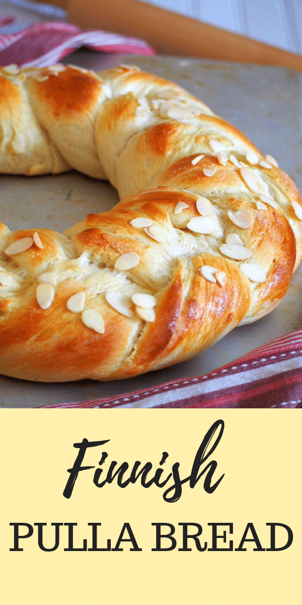 Finnish Pulla is a celebration bread braided beautifully like a wreath. It gets its nice flavor from the cardamom and it is adorned with crunchy almonds as finishing on top. #pullabread #pullarecipe #braidedwreathbread
