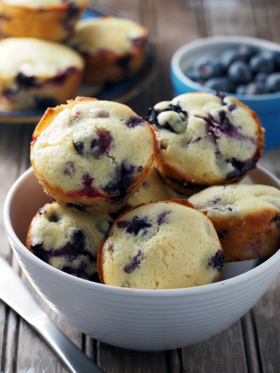 These Blueberry Muffins are delectable bites of melt in your mouth cake crumbs with a hint of freshness from the soft berries.