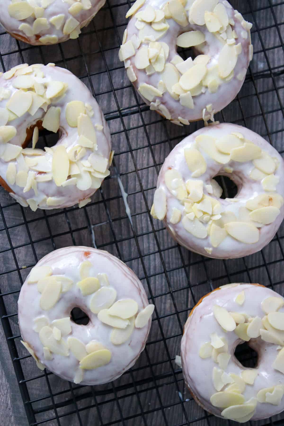 Top shot view of yeast donuts with white chocolate glaze.