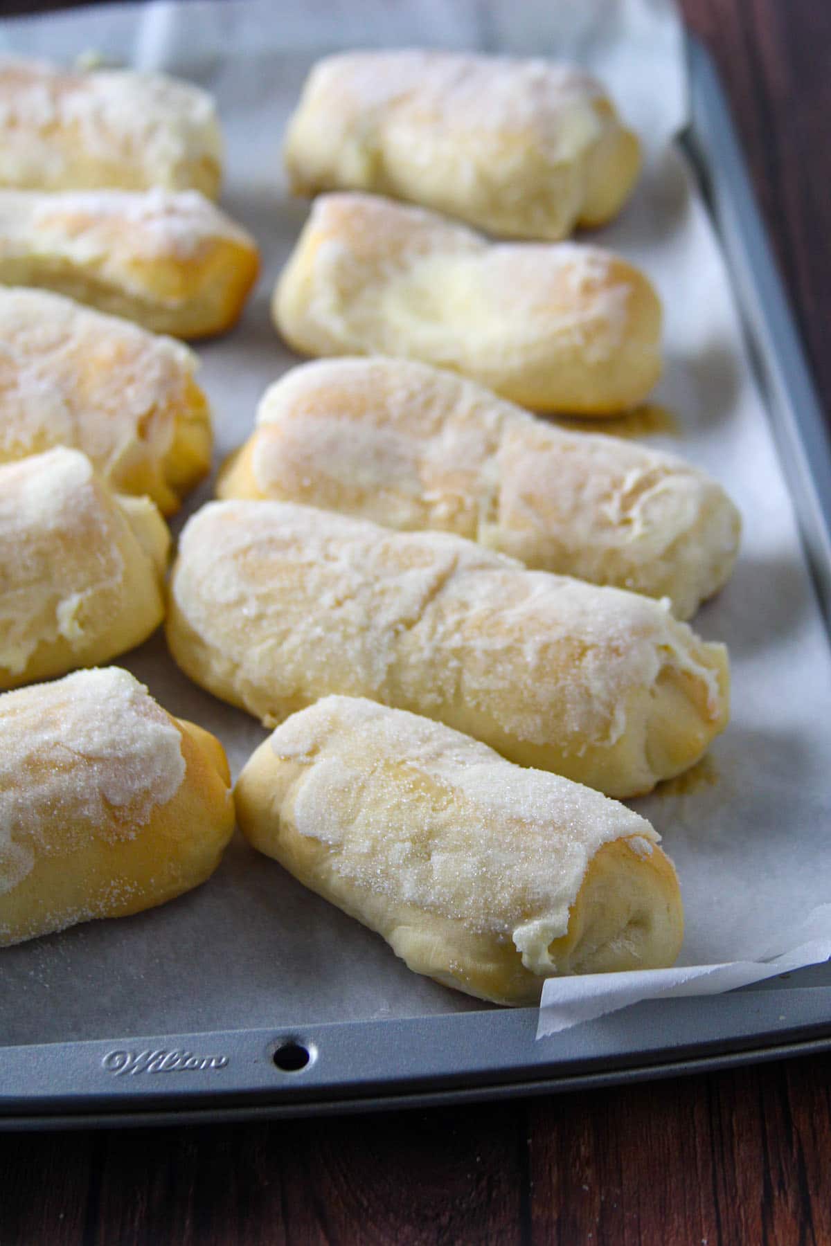 Warm cheese rolls on a tray.