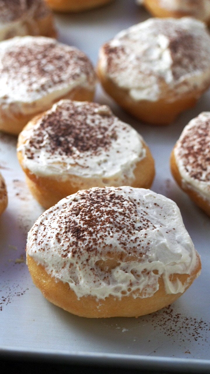 Enjoy your tiramisu in these soft and airy yeast donuts. Tiramisu Donuts are filled with light coffee cream and dusted with cocoa powder. These are your indulgent breakfast or your afternoon treat with a cup of tea. 