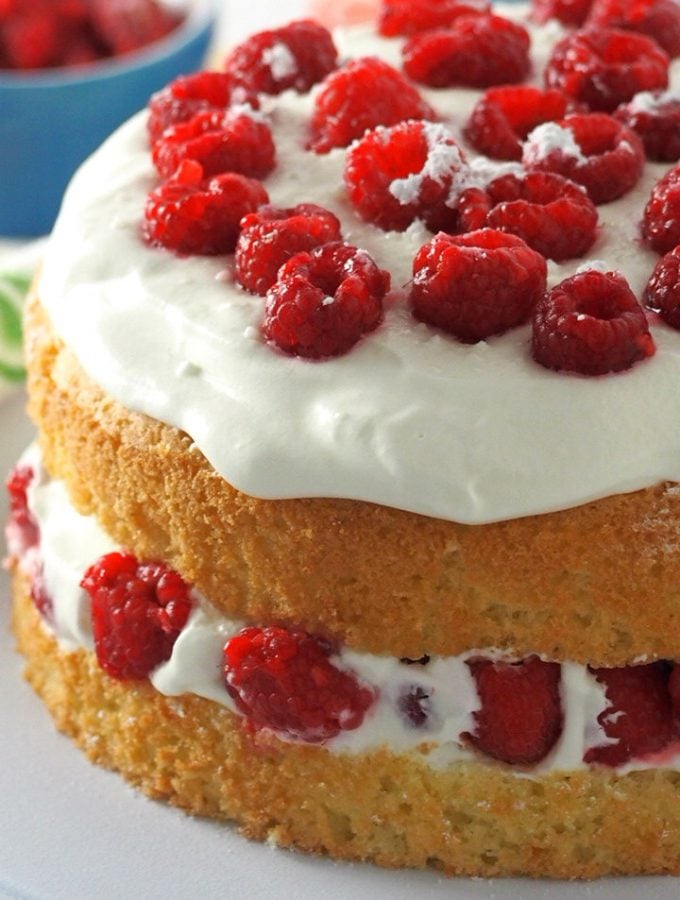 This luscious raspberry cake is filled with fresh berries and a lightly indulgent whipped cream. It is a light, heavenly cake perfect for celebrations or even as a daily light dessert.