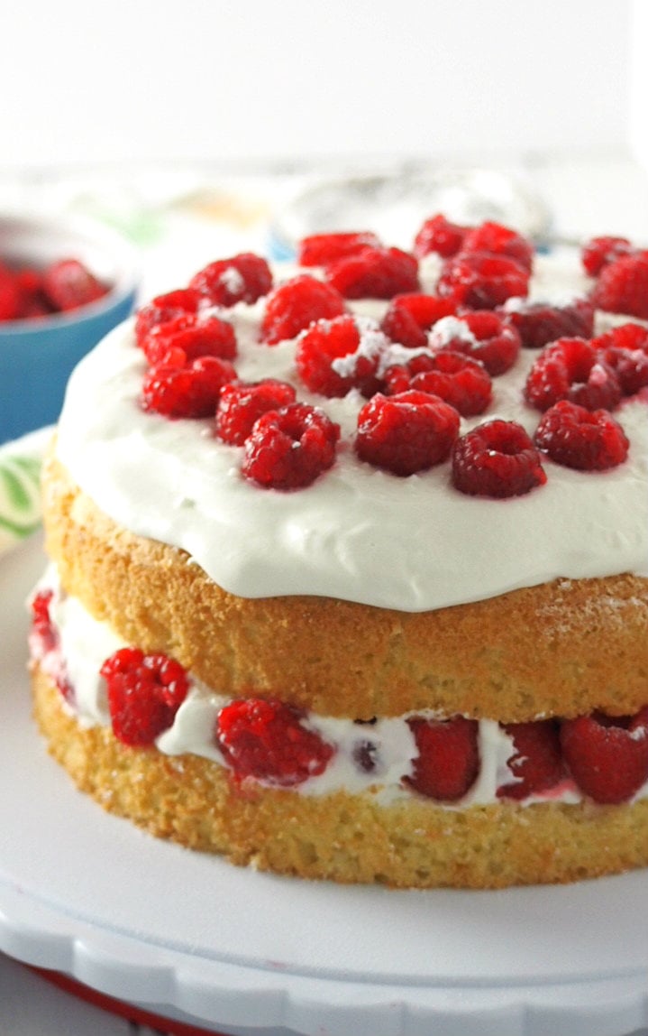 This luscious raspberry cake is filled with fresh berries and a lightly indulgent whipped cream. It is a light, heavenly cake perfect for celebrations or even as a daily light dessert.