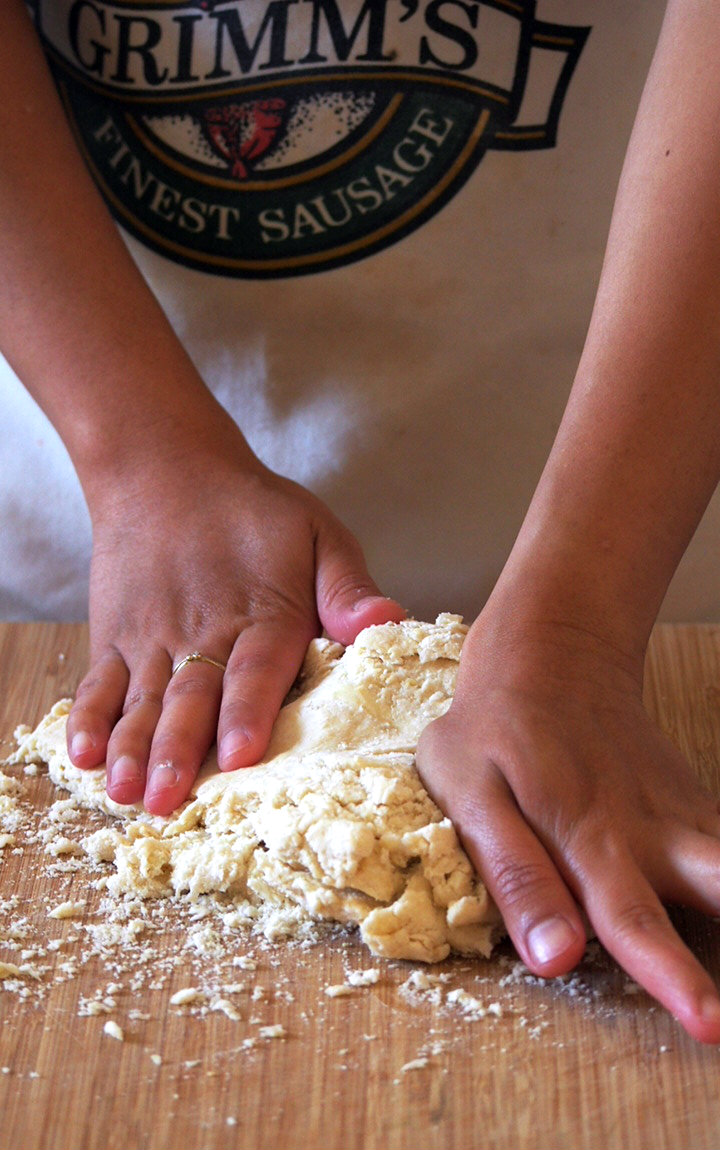 The Butter Tea Biscuit Dough is being kneaded after the addition of cream. Just a brief kneading is enough just to gather the dough into a cohesive mass.