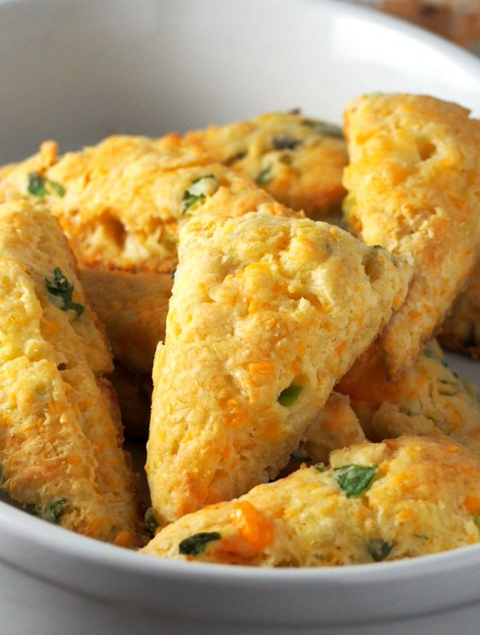 Cheesy and buttery with a good savory flavor, these Cheese Scones with Scallions are a nice treat for your breakfast or as a side dish to your meal.