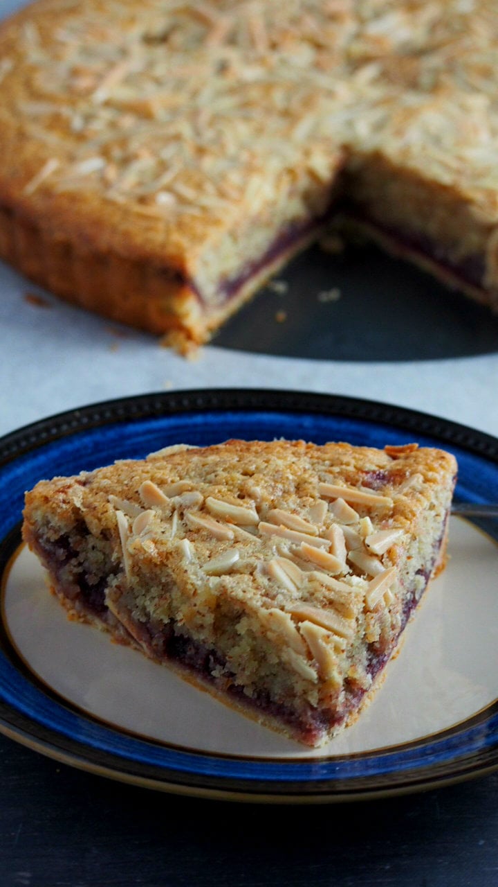 Bakewell Tart is a grand dessert made of a sweet shortcut pastry filled with a wonderful layering of raspberry jam, frangipane and flakes of almond.