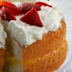 Enjoy this Lemon Angel Food Cake with Lemon Curd Filling- the cottony soft angel food cake is filled with a splash of bright flavor from the lemon curd, then finished with a whipped cream topping.