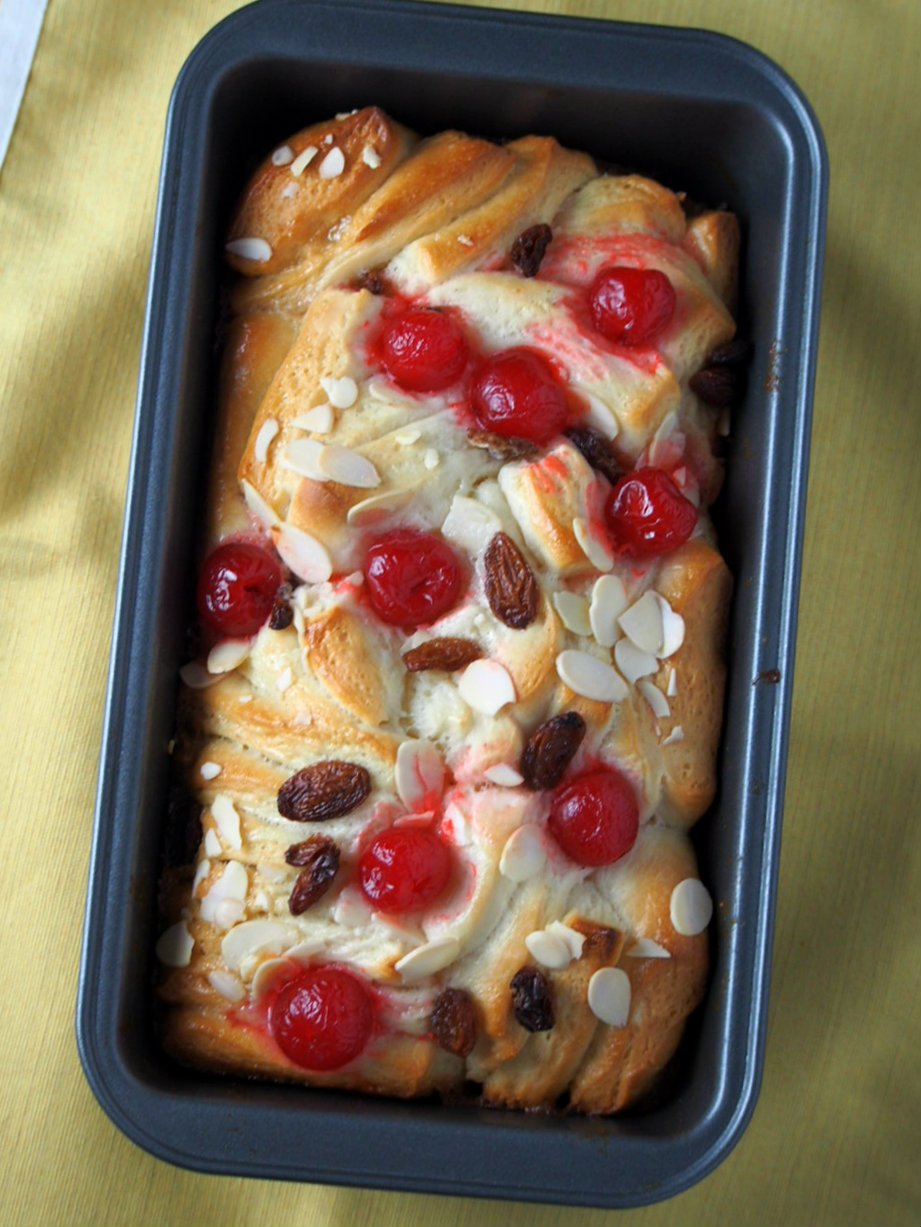 Top angle of Japanese Condensed Milk Bread showing the raisins, almonds and cherries.