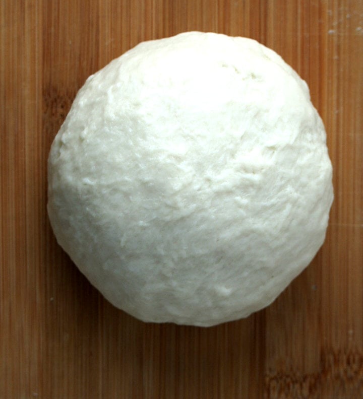 Kneaded dough shaped into ball. 