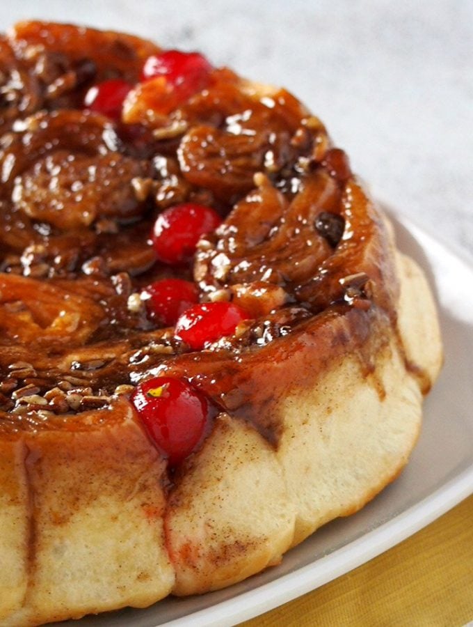 Chelsea Buns are your festive, colorful cinnamon rolls with all the delightful add-ons like raisins, pecans and cherries.