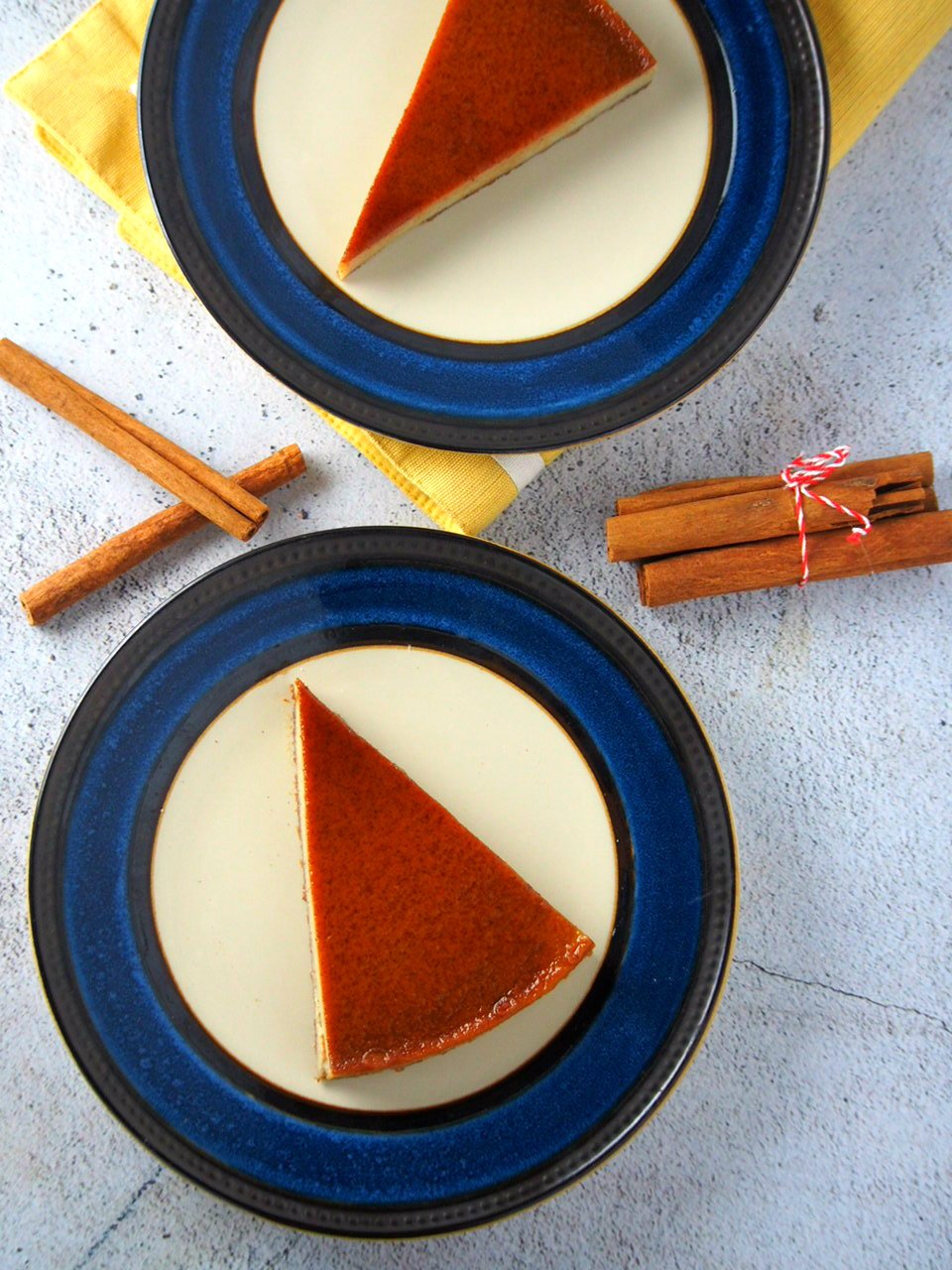 Slices of Cinnamon Flan, each in a saucer plate.