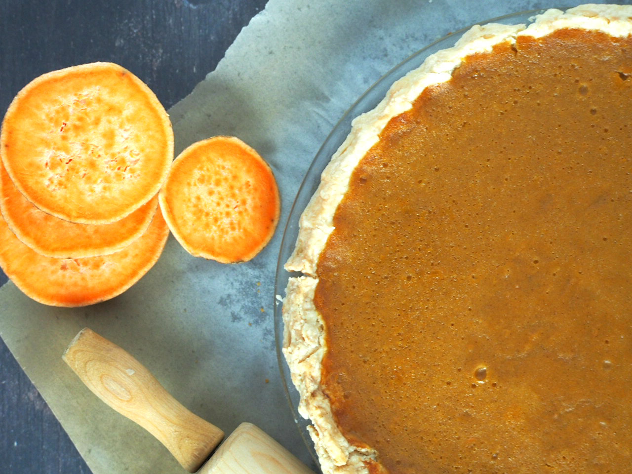 Top angle view of the sweet potato pie in a pie pan.