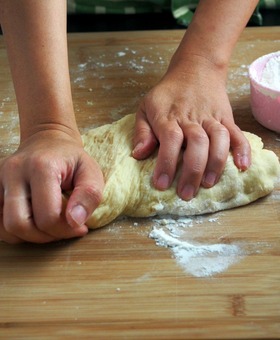 Kneading the dough of pineapple buns.