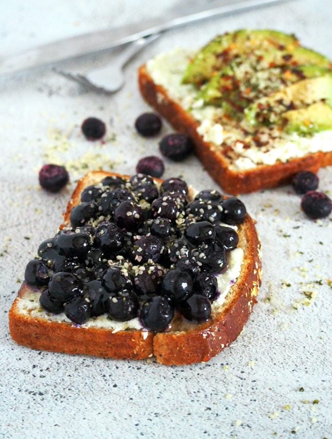 Blueberry breakfast toast with hemp seeds sprinkled on top.