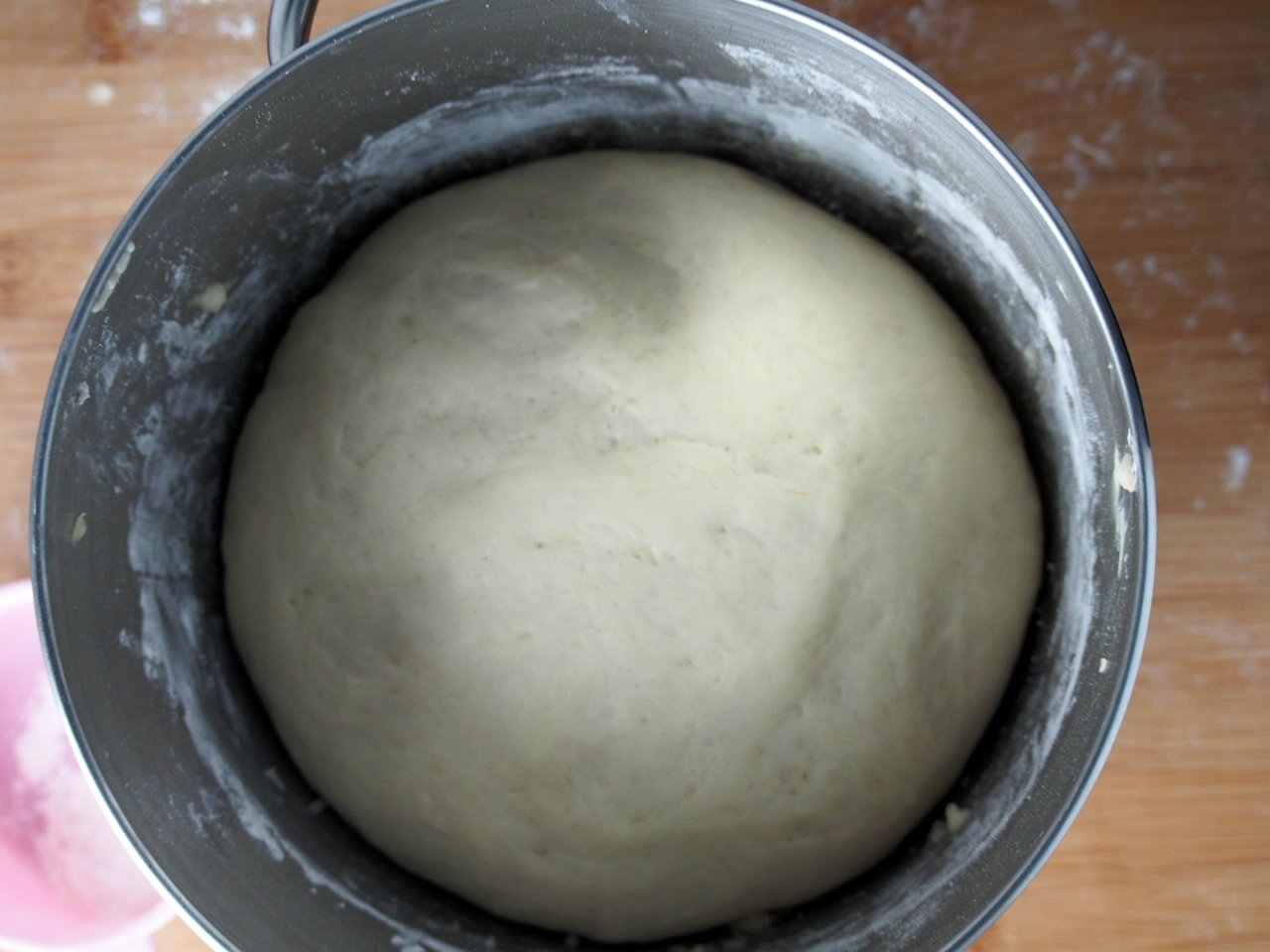 The risen dough of milk and sugar mini buns.