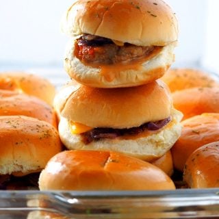 Chicken Burger Sliders stacked and lined up in a baking dish.