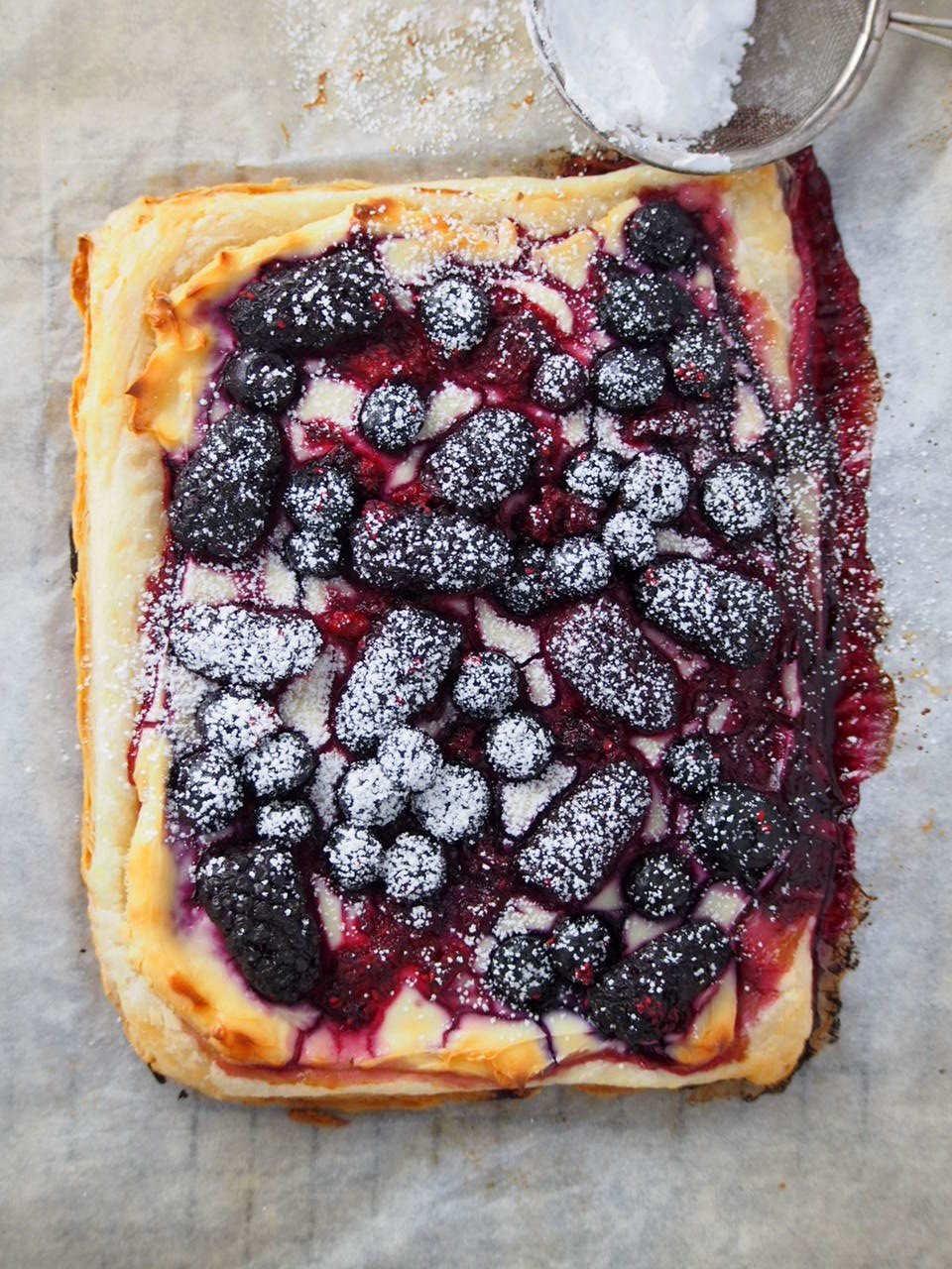 Berry Tart dusted with powdered sugar.