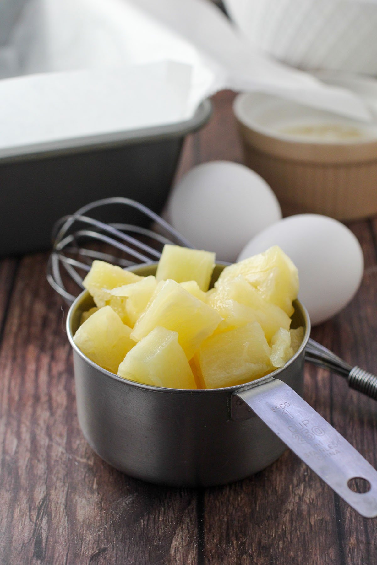 Pineapples and eggs, the ingredients for the Pineapple Loaf Cake.