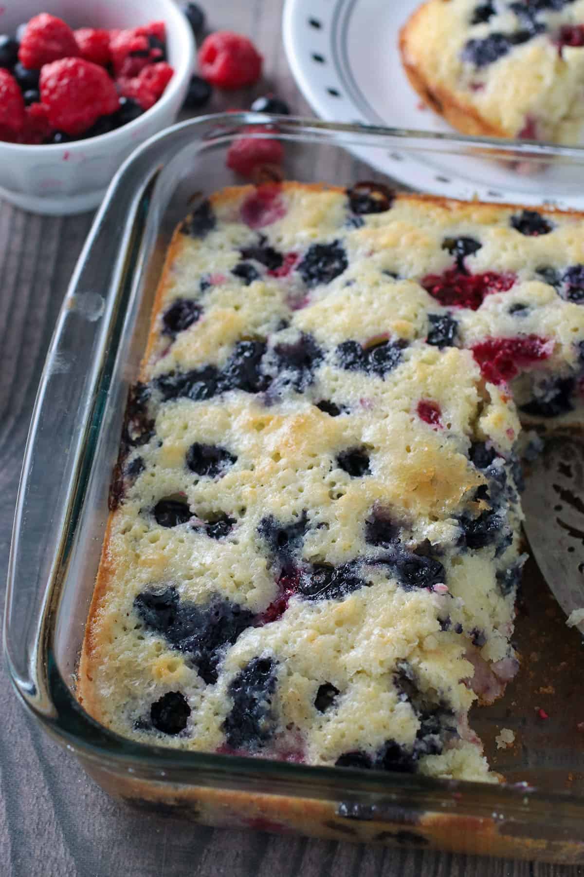 Close up top shot of an easy berry cake in a baking dish.