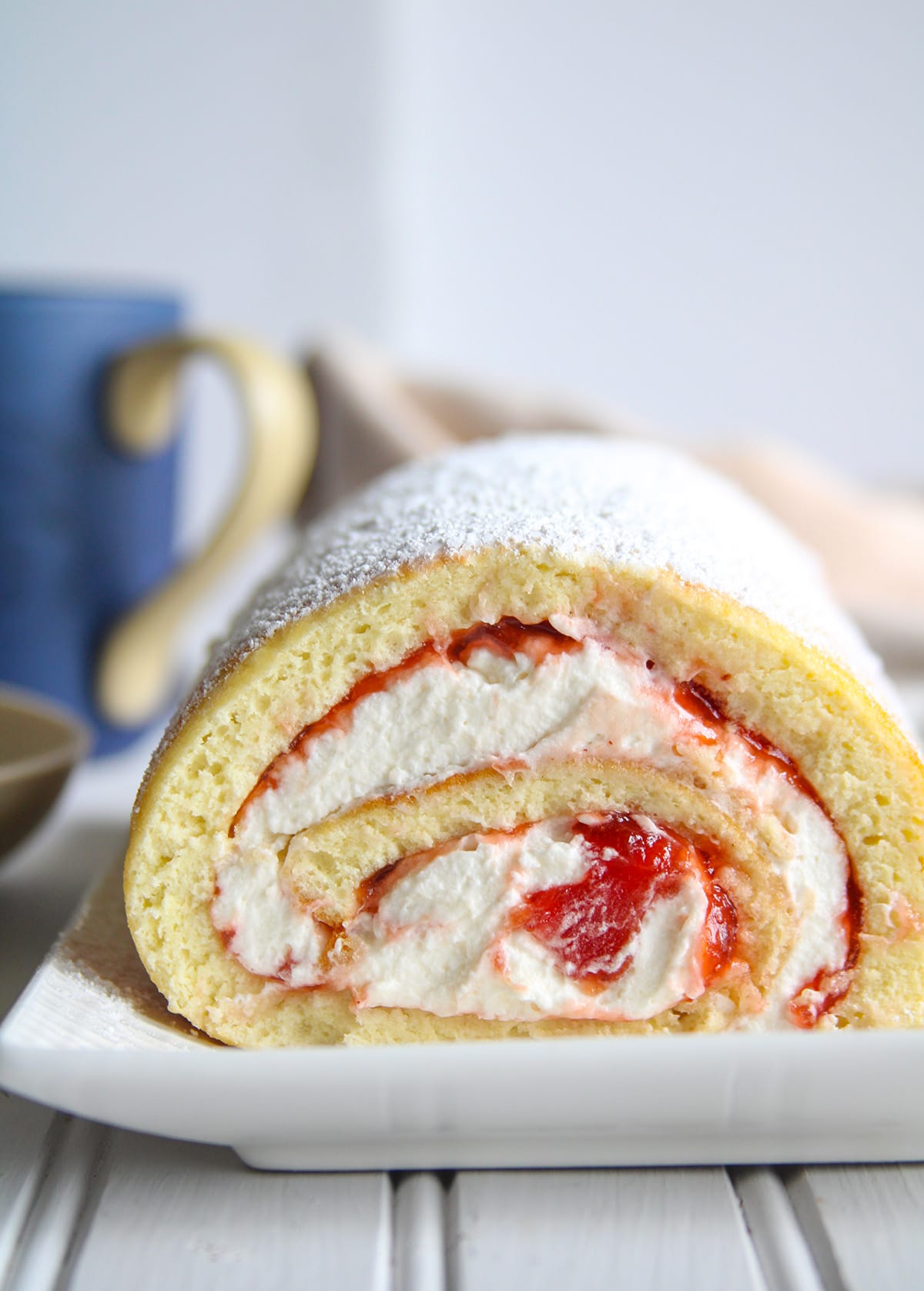 close up shot of Vanilla Swiss Roll on a serving plate.