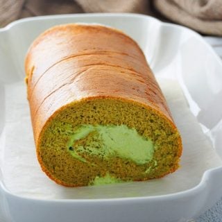 Matcha Roll cake on a serving plate.