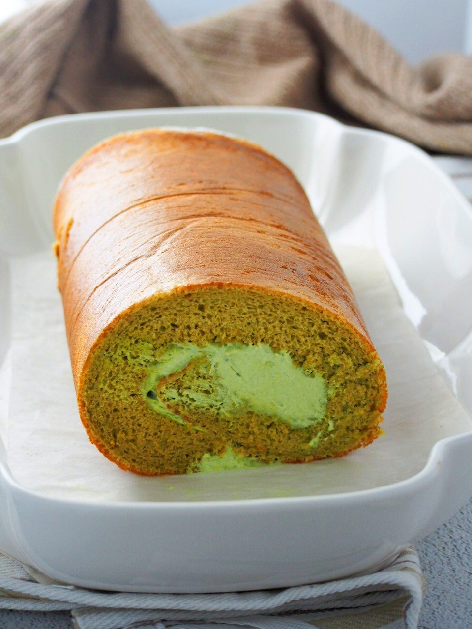 Matcha Roll cake on a serving plate.