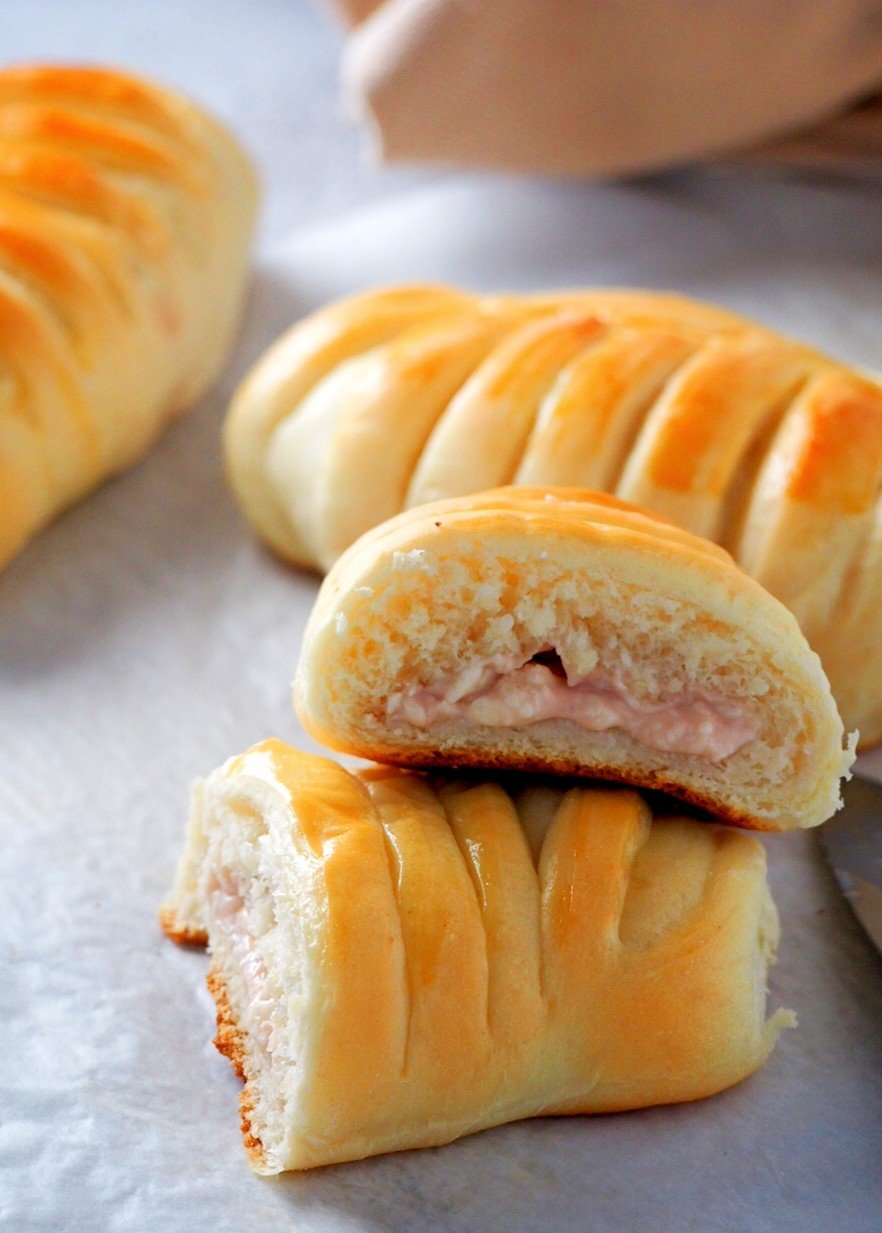 Strawberry Cream buns showing the filling inside.