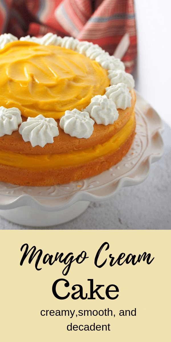 Luscious mango cream in between sponge layers, this Mango Cream Cake is an ultimately decadent mango treat. #mangocake #mangospongecake #mangodessert