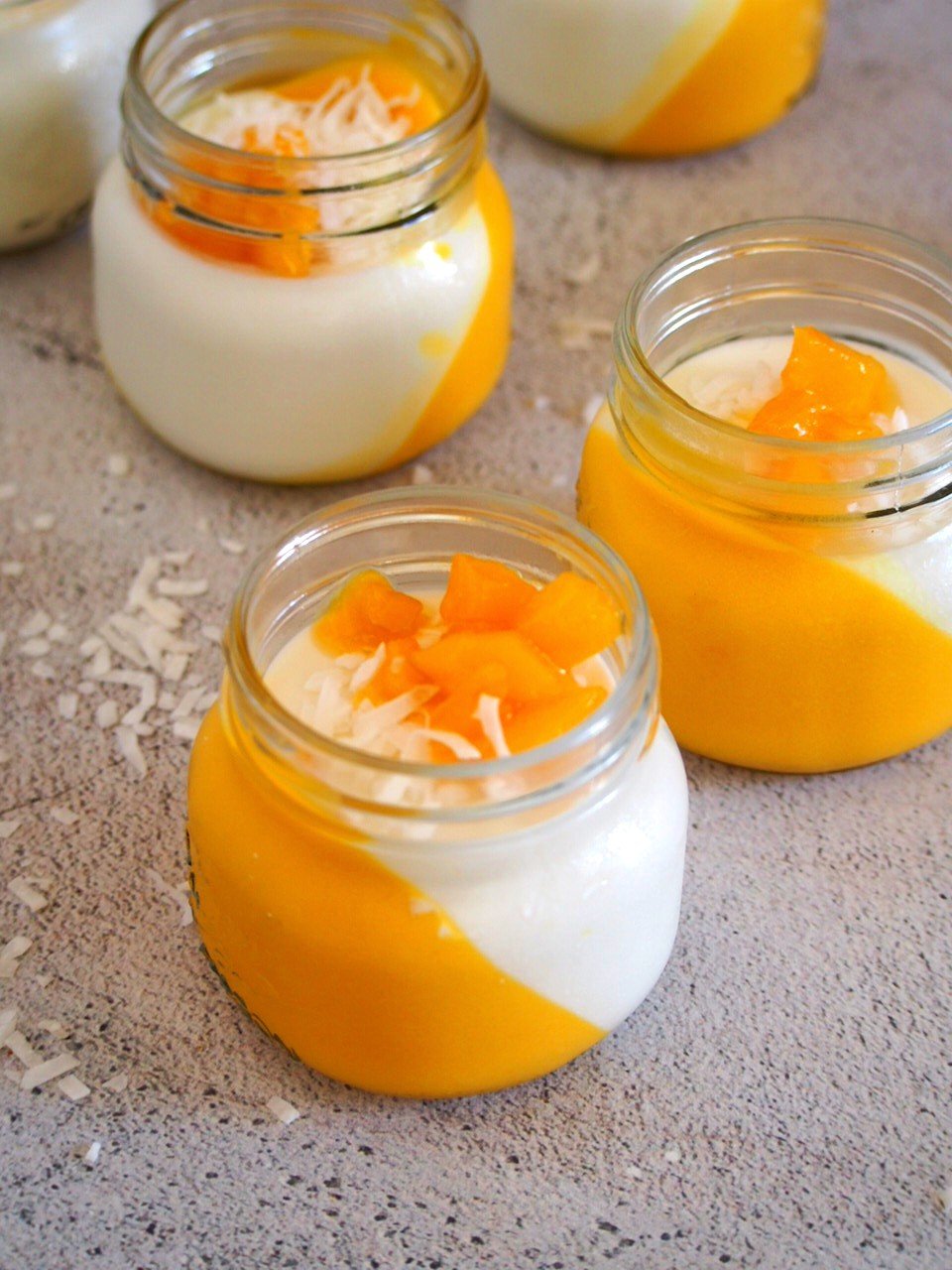The coconut mango panna cotta with caramelized mangoes and flaked coconut.