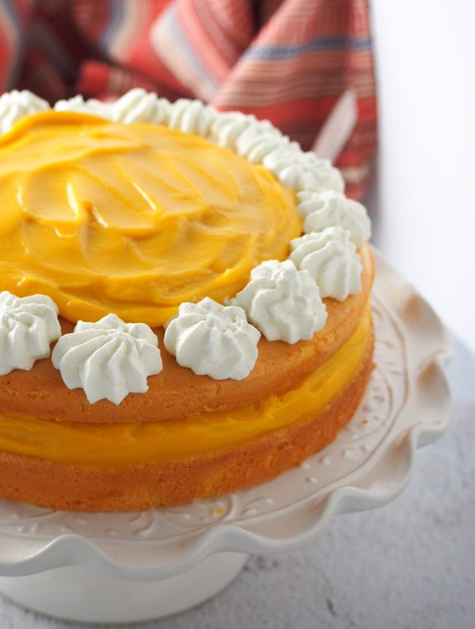 Close up shot of mango cream cake.