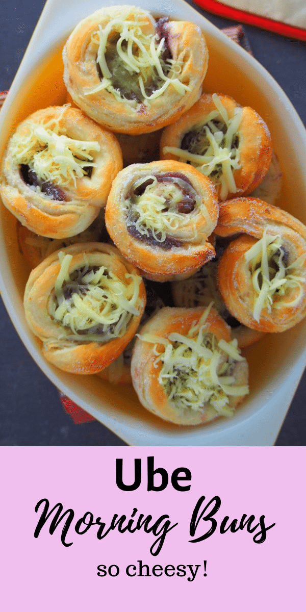 These Ube Morning Buns are another delicious take on the famous morning buns. They are flaky bread dough filled with ube jam and are finished with a coating of sugar and lots of shredded cheese. #ubebread #ubebuns #purpleyambuns | Woman Scribbles