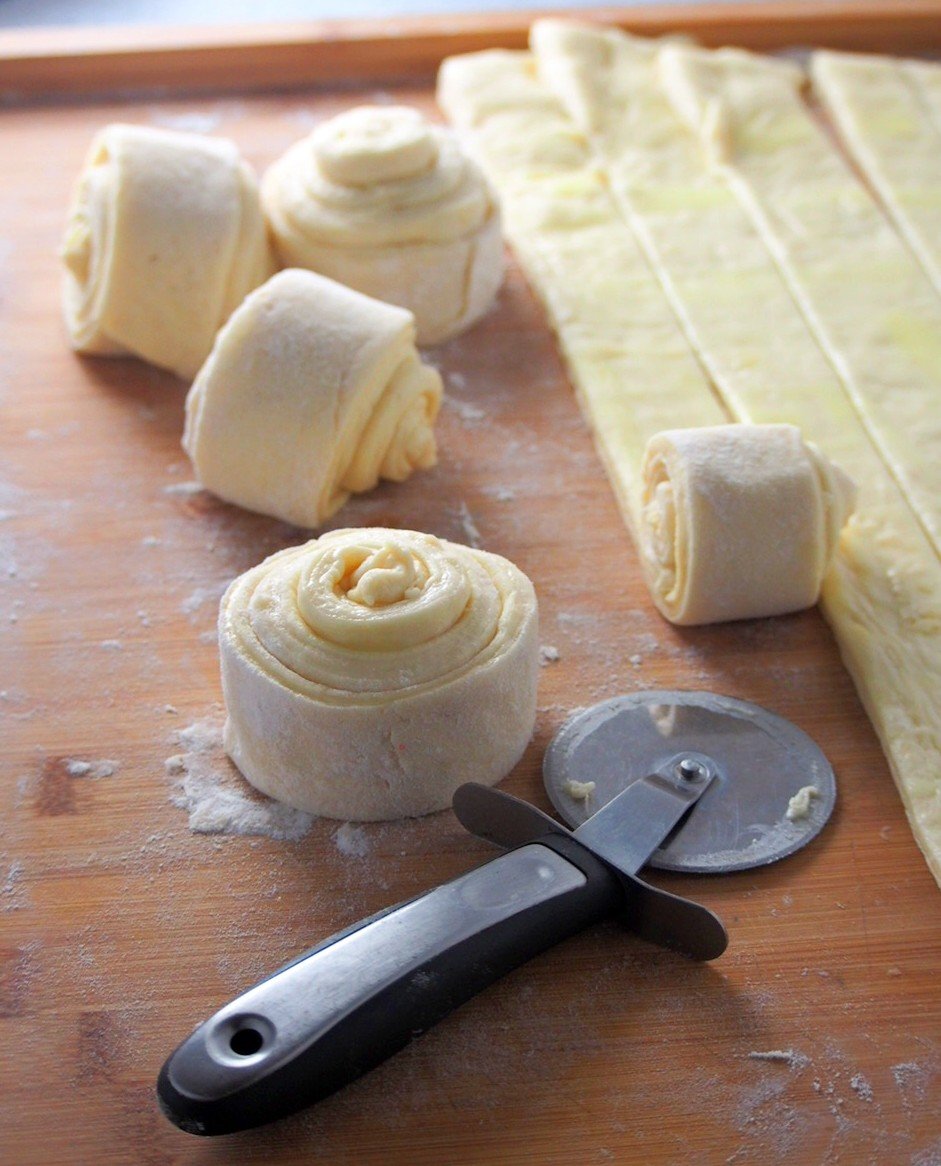 Shaping the mallorca dough into coils.