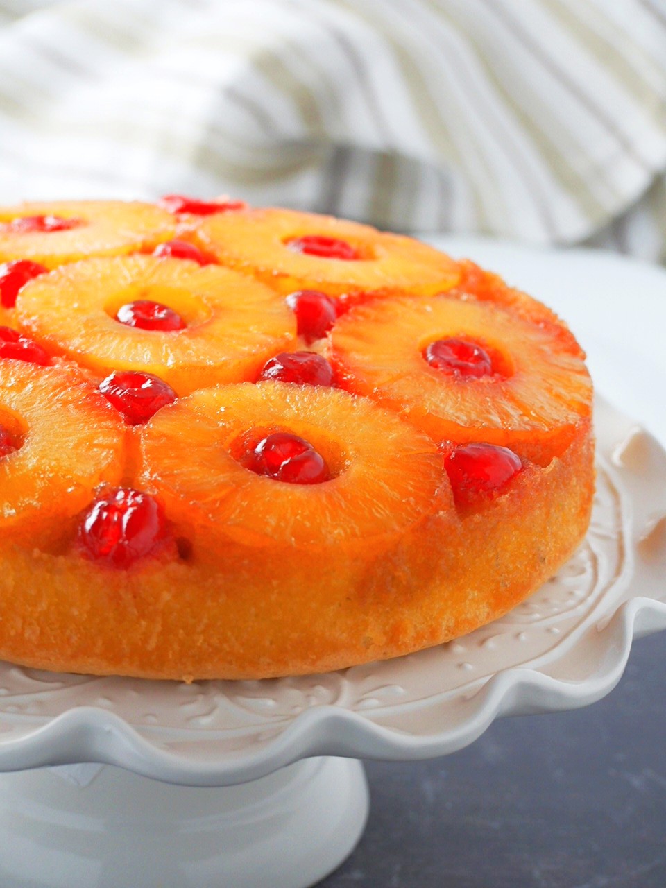 PIneapple Upside Down Cake on a cake stand.