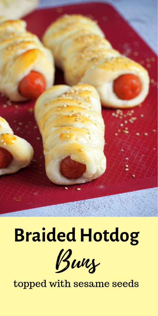 Soft and tasty buns braided around juicy hotdogs then topped with sesame seeds, these Braided Hotdog Buns are filling and addictive! #hotdogs #braidedbuns #sausagebuns